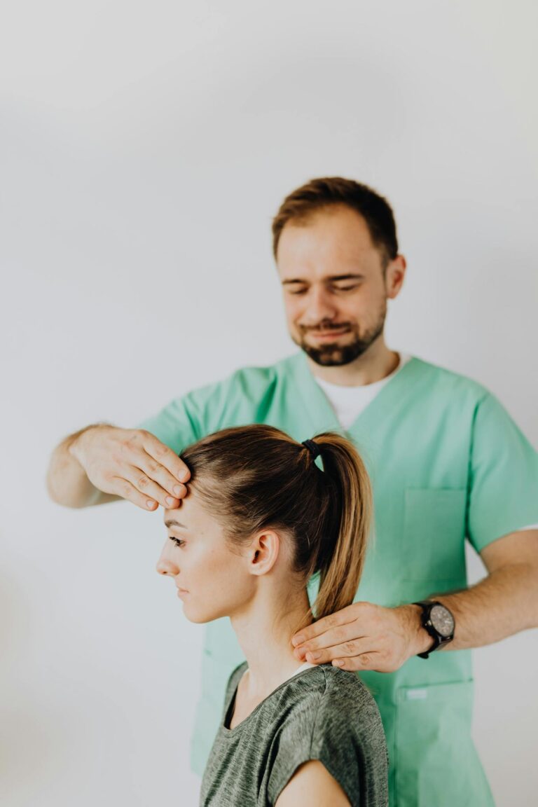 Professional Massage Therapist Treating a Female Patient's Injured Neck